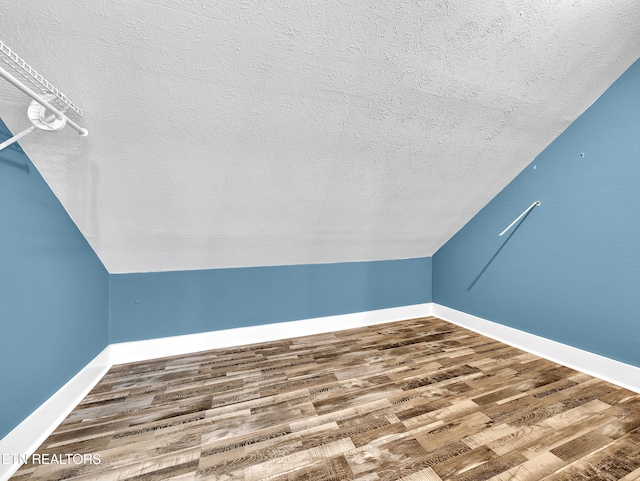 1100 Cedar Ln, Knoxville, TN 37912 - bonus room with a textured ceiling, wood finished floors, and lofted ceiling