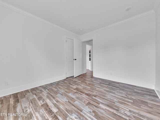 1100 Cedar Ln, Knoxville, TN 37912 - empty room with wood finished floors and ornamental molding