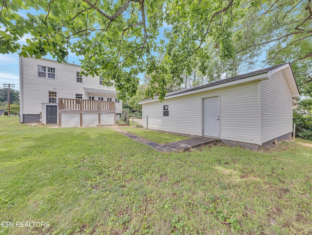 1100 Cedar Ln, Knoxville, TN 37912 - back of property featuring a yard, a deck, and an outbuilding