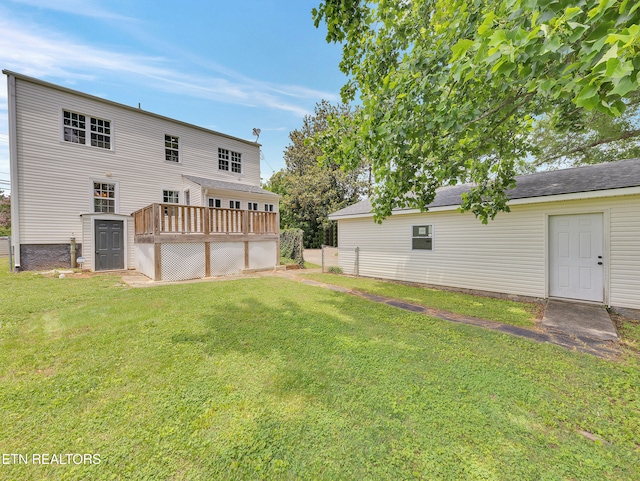 1100 Cedar Ln, Knoxville, TN 37912 - rear view of property featuring a wooden deck, a lawn, and a shed