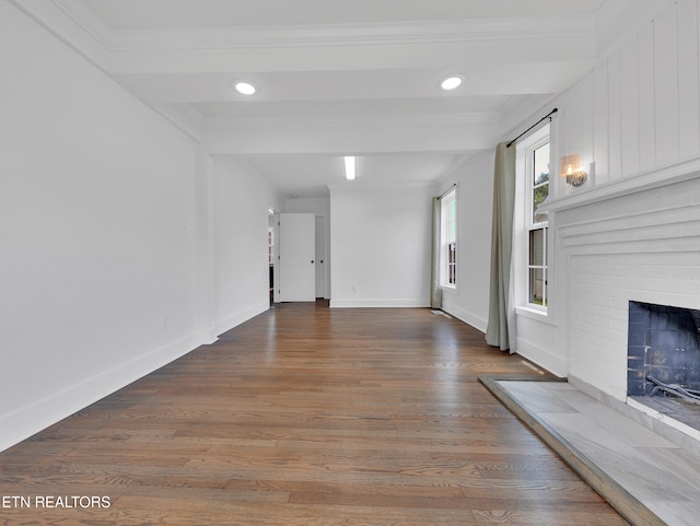 1100 Cedar Ln, Knoxville, TN 37912 - unfurnished living room featuring a brick fireplace, wood finished floors, ornamental molding, and recessed lighting