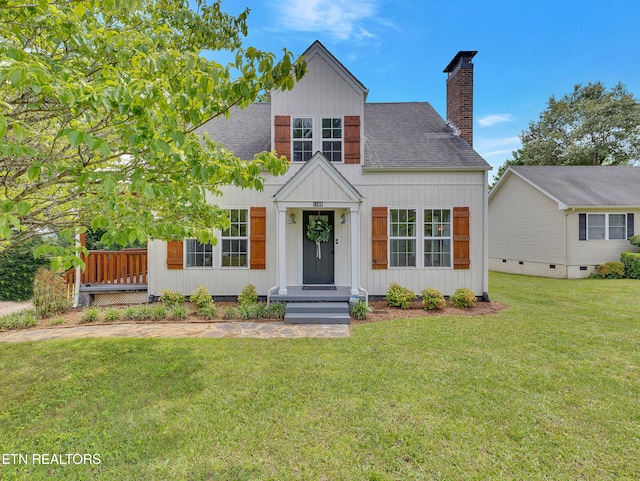 1100 Cedar Ln, Knoxville, TN 37912 - view of front facade with a shingled roof, board and batten siding, a front yard, and a chimney