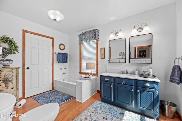 1292 Deer Lodge Hwy, Sunbright, TN 37872 - bathroom featuring a garden tub, vanity, and wood finished floors