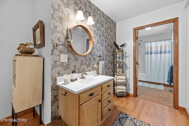1292 Deer Lodge Hwy, Sunbright, TN 37872 - bathroom featuring vanity, wood finished floors, and wallpapered walls