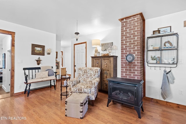 1292 Deer Lodge Hwy, Sunbright, TN 37872 - sitting room featuring light wood-style flooring and a wood stove