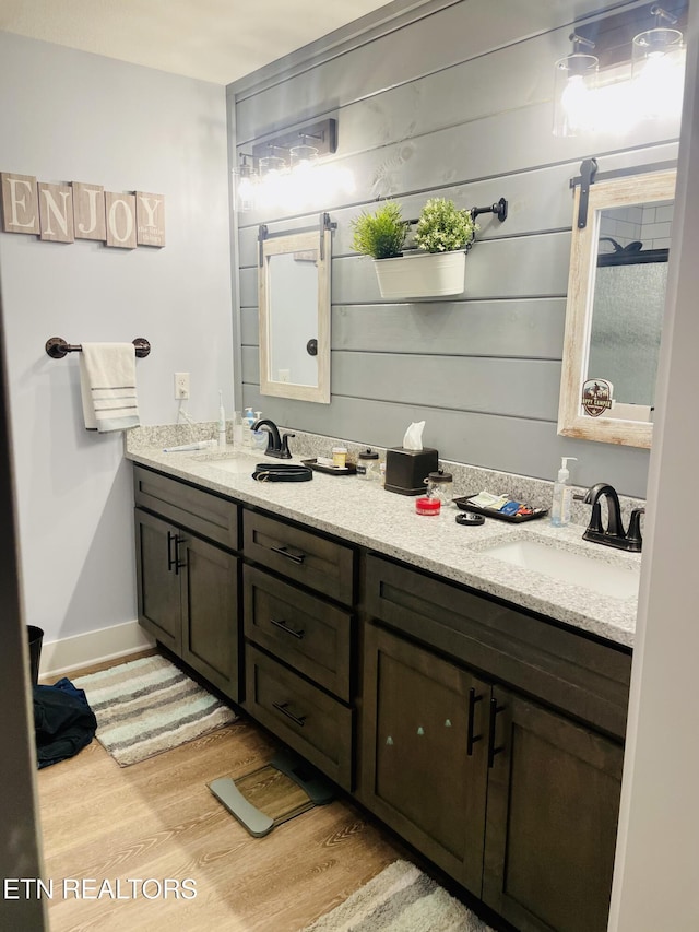 669 Crooked Branch Pvt Rd, Huntsville, TN 37756 - full bathroom featuring double vanity and wood finished floors