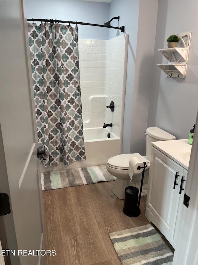 669 Crooked Branch Pvt Rd, Huntsville, TN 37756 - bathroom featuring vanity, shower / bathtub combination with curtain, and wood finished floors