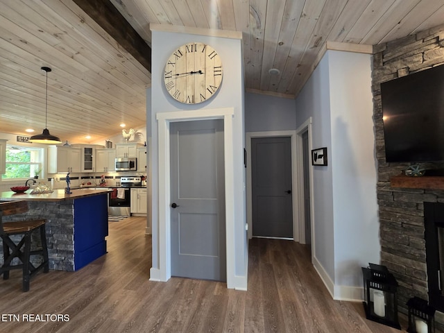669 Crooked Branch Pvt Rd, Huntsville, TN 37756 - kitchen featuring stainless steel appliances, wooden ceiling, a breakfast bar, glass insert cabinets, and dark countertops