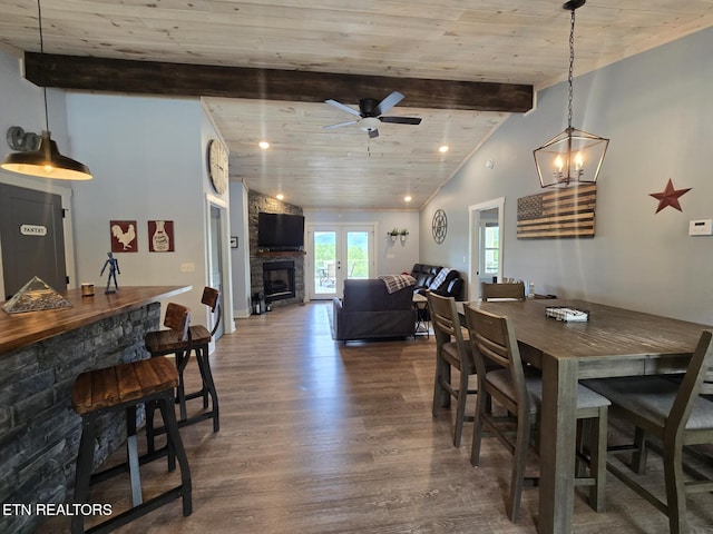 669 Crooked Branch Pvt Rd, Huntsville, TN 37756 - dining area with wood finished floors, ceiling fan, a fireplace, and wooden ceiling