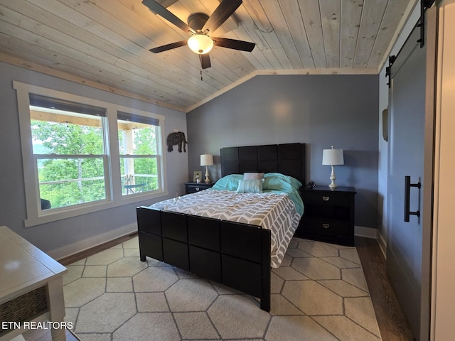 669 Crooked Branch Pvt Rd, Huntsville, TN 37756 - bedroom featuring vaulted ceiling, a barn door, wood ceiling, a ceiling fan, and light wood finished floors