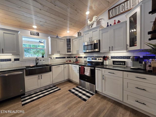 669 Crooked Branch Pvt Rd, Huntsville, TN 37756 - kitchen with stainless steel appliances, wooden ceiling, dark countertops, recessed lighting, and light wood-style floors