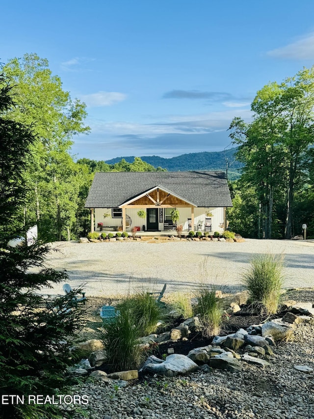 669 Crooked Branch Pvt Rd, Huntsville, TN 37756 - view of side of property featuring covered porch, dirt driveway, and a mountain view