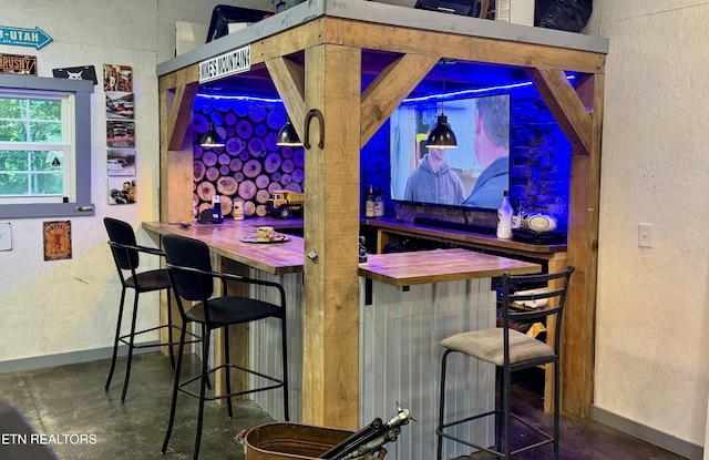 669 Crooked Branch Pvt Rd, Huntsville, TN 37756 - indoor dry bar featuring a textured wall and concrete floors