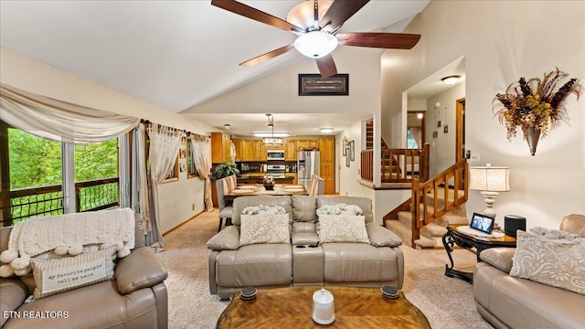 573 Hilltop Dr, Jacksboro, TN 37757 - living area featuring lofted ceiling, light carpet, stairs, and a ceiling fan