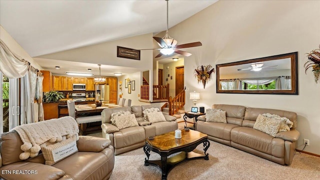573 Hilltop Dr, Jacksboro, TN 37757 - living room with a ceiling fan, vaulted ceiling, and stairway