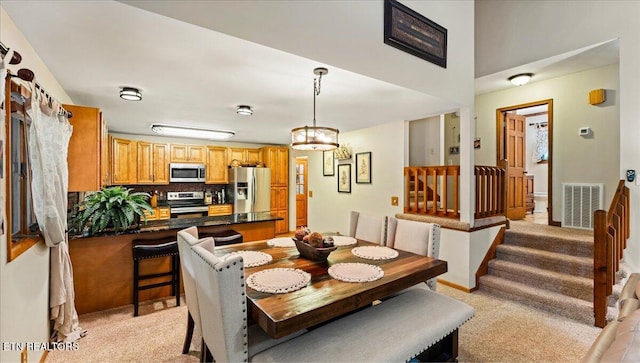 573 Hilltop Dr, Jacksboro, TN 37757 - dining room featuring stairs and light colored carpet