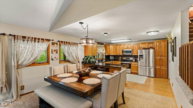 573 Hilltop Dr, Jacksboro, TN 37757 - dining area with lofted ceiling and light carpet