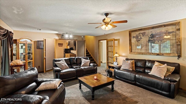 573 Hilltop Dr, Jacksboro, TN 37757 - carpeted living area with ceiling fan, a textured ceiling, and stairway