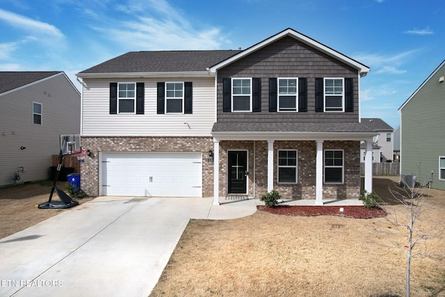 3235 NE Rolling Meadow Way, Cleveland, TN 37323 - view of front of house featuring covered porch, brick siding, driveway, roof with shingles, and a garage