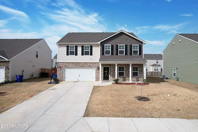 3235 NE Rolling Meadow Way, Cleveland, TN 37323 - view of front facade with concrete driveway, a porch, brick siding, a garage, and roof with shingles