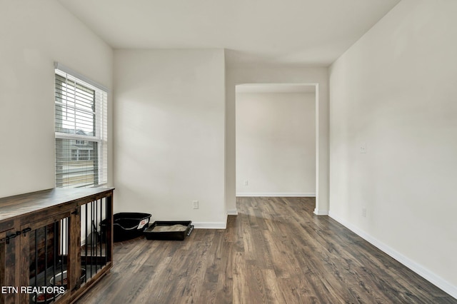 3235 NE Rolling Meadow Way, Cleveland, TN 37323 - spare room with dark wood-style flooring and baseboards