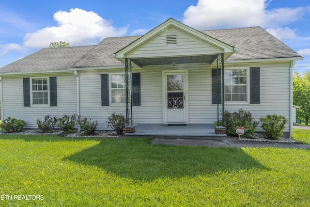 7518 Clapps Chapel Rd, Corryton, TN 37721 - bungalow with a porch, a front yard, and a shingled roof