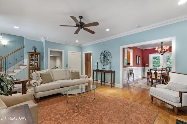 232 Park Meade Pl, Oak Ridge, TN 37830 - living room featuring light wood finished floors, stairway, ceiling fan, ornamental molding, and a chandelier