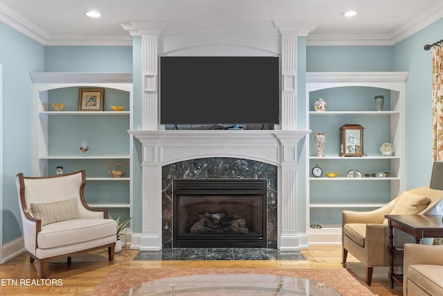 232 Park Meade Pl, Oak Ridge, TN 37830 - sitting room with wood finished floors, built in shelves, decorative columns, a premium fireplace, and ornamental molding