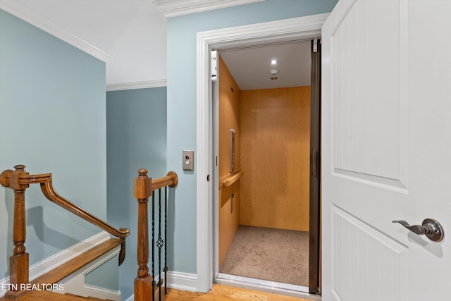 232 Park Meade Pl, Oak Ridge, TN 37830 - hallway featuring elevator, crown molding, wood finished floors, and an upstairs landing