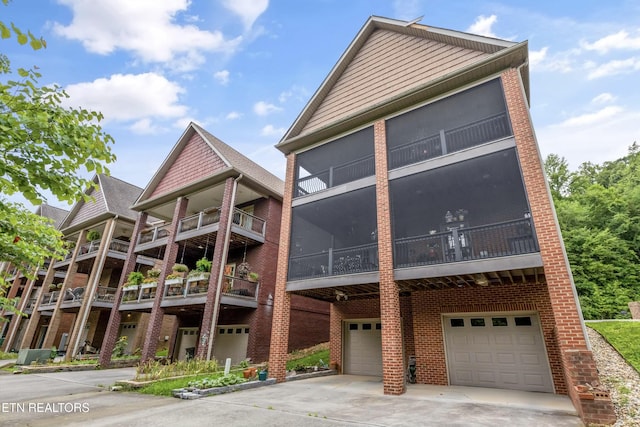 232 Park Meade Pl, Oak Ridge, TN 37830 - view of front of property with brick siding, a garage, and driveway