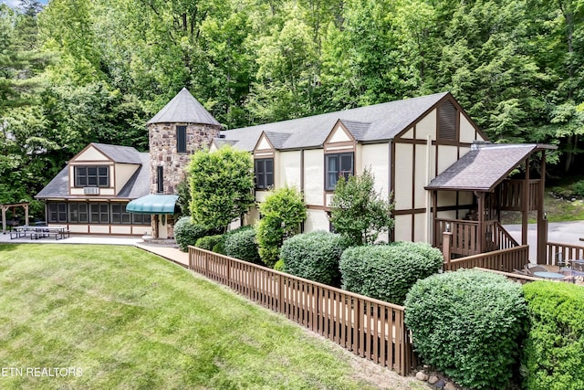 3950 Castle Rd, Gatlinburg, TN 37738 - rear view of house with a lawn and stucco siding