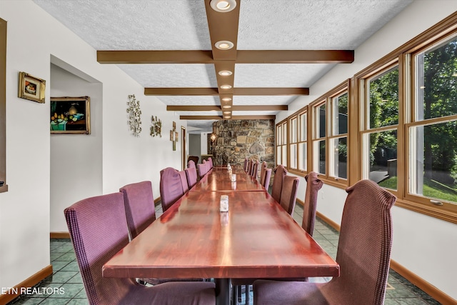 3950 Castle Rd, Gatlinburg, TN 37738 - tiled dining space with a textured ceiling, beamed ceiling, and recessed lighting