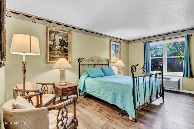 3950 Castle Rd, Gatlinburg, TN 37738 - bedroom with a textured ceiling and wood-type flooring