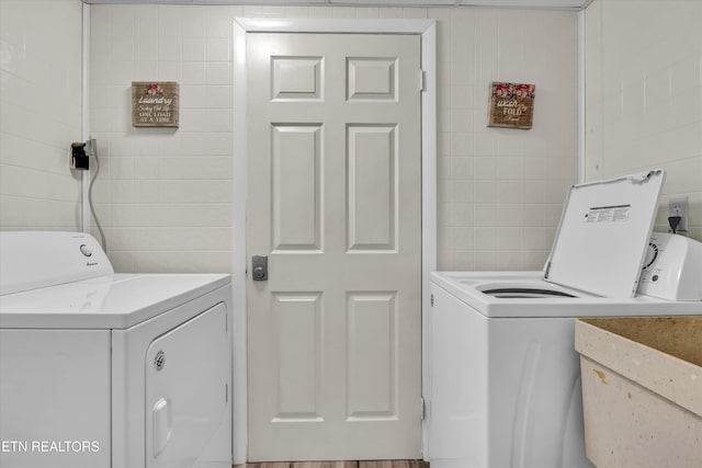 3950 Castle Rd, Gatlinburg, TN 37738 - washroom featuring washing machine and dryer and tile walls