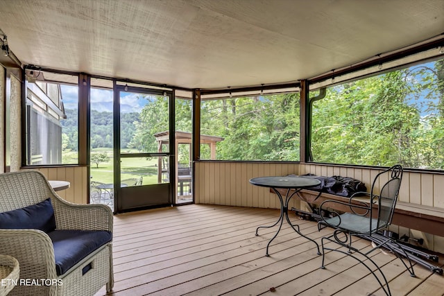 3950 Castle Rd, Gatlinburg, TN 37738 - sunroom / solarium featuring view of wooded area