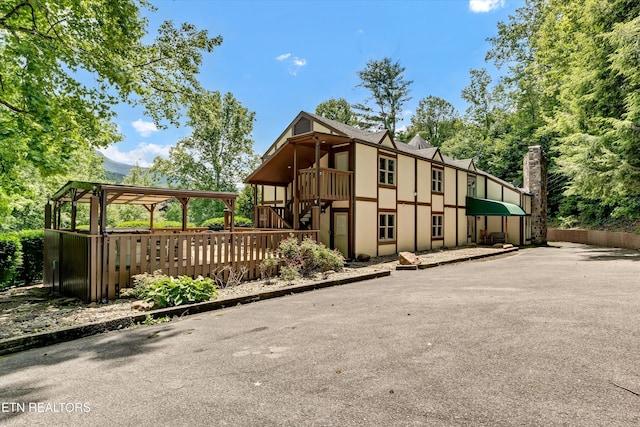 3950 Castle Rd, Gatlinburg, TN 37738 - view of property exterior with stairs and stucco siding