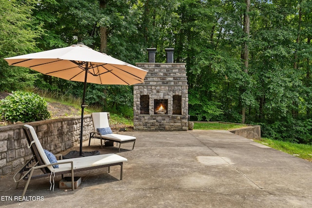 203 Georgian Ln, Sevierville, TN 37862 - view of patio featuring an outdoor stone fireplace