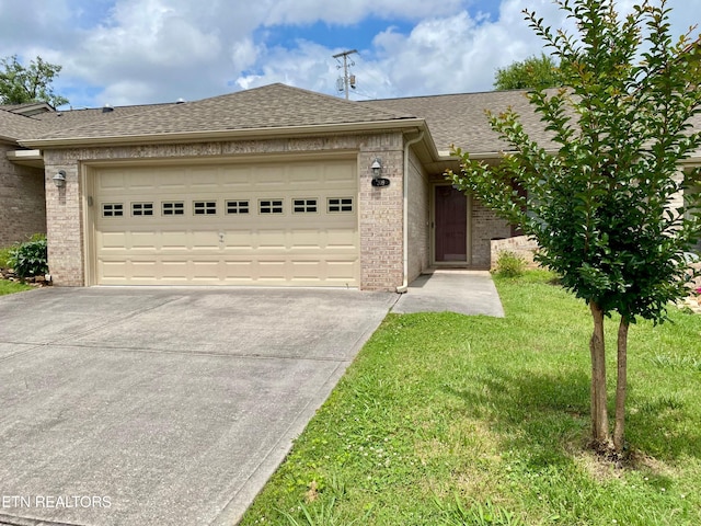209 Commander Way, Knoxville, TN 37934 - view of front of property with concrete driveway, brick siding, a garage, and roof with shingles