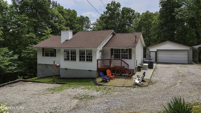 113 Skyland Ln, Powell, TN 37849 - view of front of house with an outbuilding, crawl space, a garage, a chimney, and roof with shingles