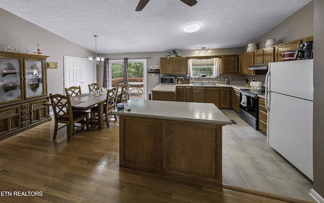 113 Skyland Ln, Powell, TN 37849 - kitchen featuring electric stove, freestanding refrigerator, under cabinet range hood, a ceiling fan, and light countertops
