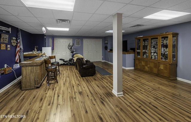 113 Skyland Ln, Powell, TN 37849 - living room with wood-type flooring, bar, and a drop ceiling