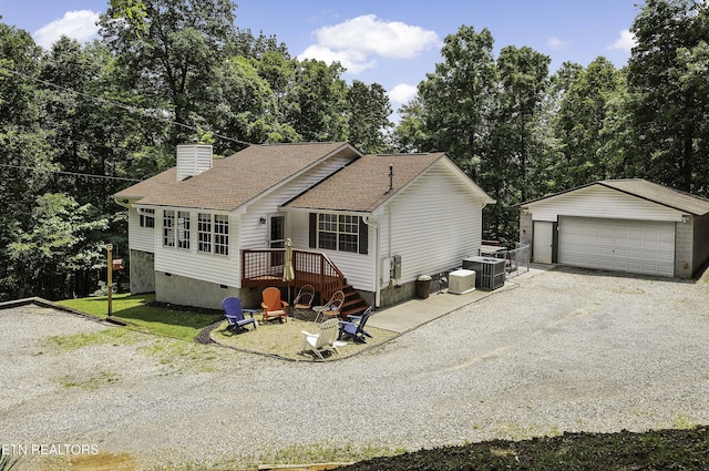 113 Skyland Ln, Powell, TN 37849 - view of front of property with crawl space, a detached garage, an outdoor structure, roof with shingles, and a chimney