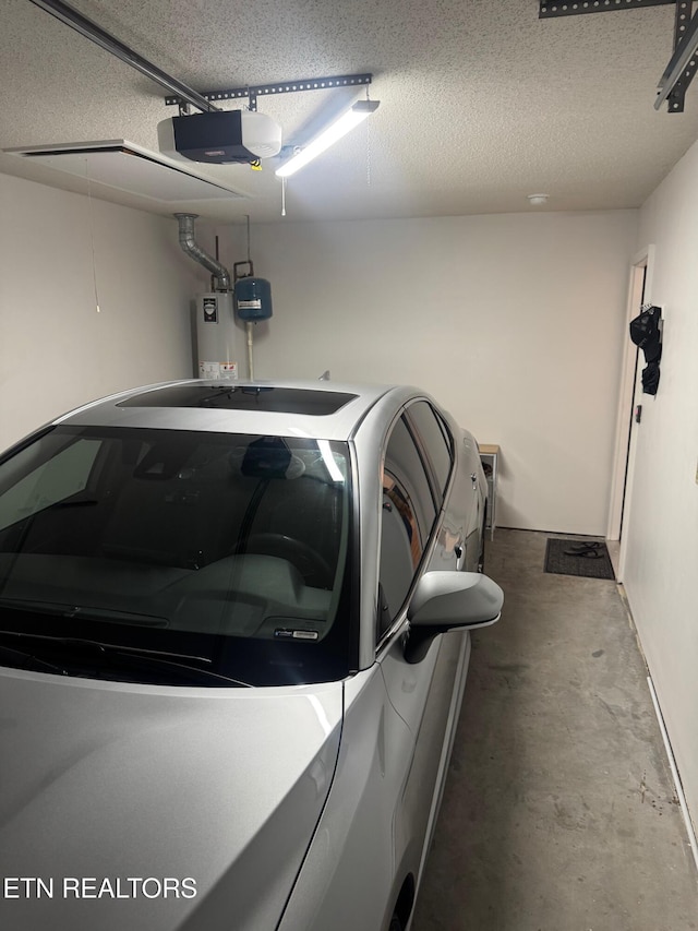 7925 Eldin Way, Powell, TN 37849 - garage with gas water heater and a garage door opener