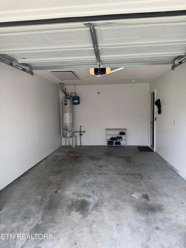 7925 Eldin Way, Powell, TN 37849 - garage featuring water heater and a garage door opener