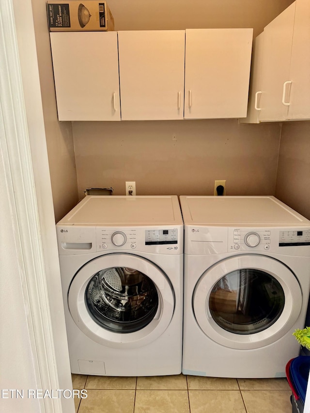 7925 Eldin Way, Powell, TN 37849 - laundry area with cabinet space, washing machine and dryer, and tile patterned flooring