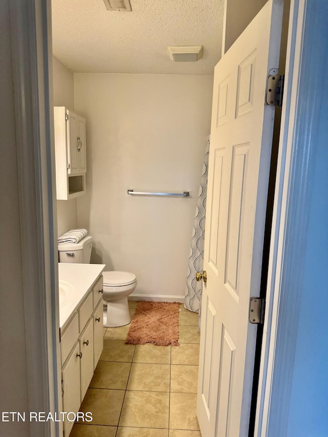 7925 Eldin Way, Powell, TN 37849 - full bathroom featuring vanity, tile patterned floors, and a textured ceiling
