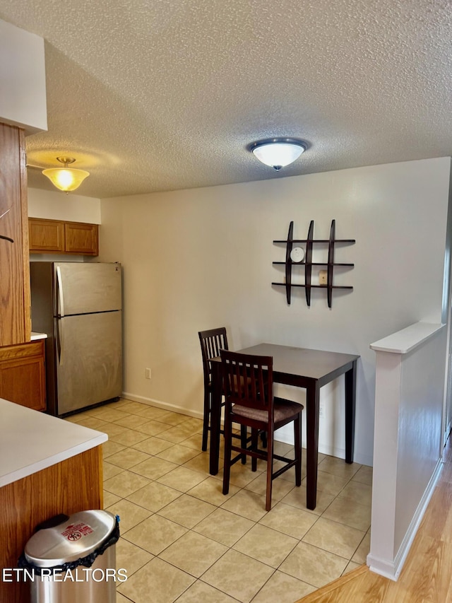 7925 Eldin Way, Powell, TN 37849 - dining space featuring a textured ceiling and light tile patterned floors