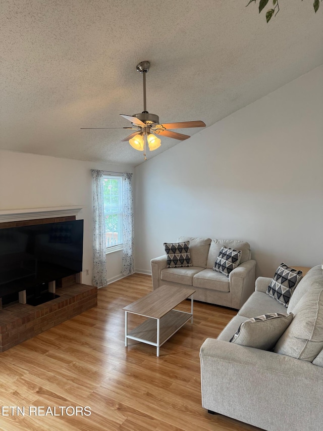 7925 Eldin Way, Powell, TN 37849 - living area with a textured ceiling, light wood-type flooring, ceiling fan, and vaulted ceiling