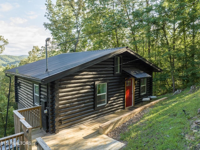 1065 Shell Mountain Rd, Sevierville, TN 37876 - log home featuring log siding, a deck, and a metal roof