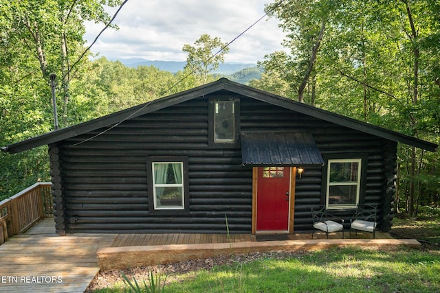 1065 Shell Mountain Rd, Sevierville, TN 37876 - log-style house featuring log exterior, a wooden deck, and a metal roof